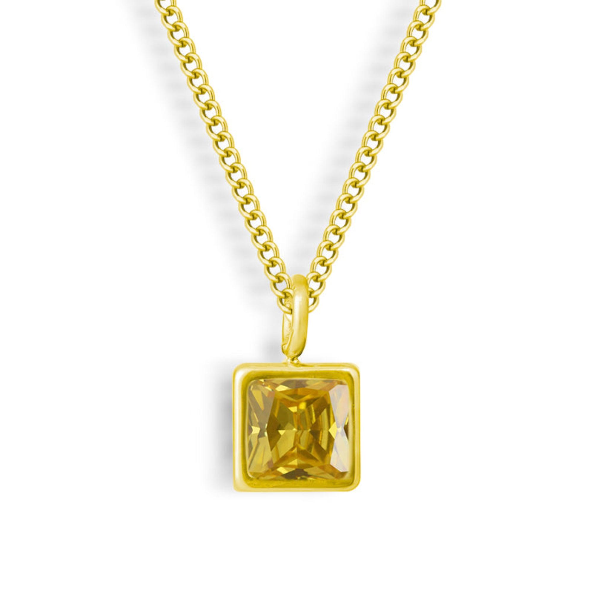 Square-Cut Stone Ring with Gold-Tone Band and Geometric Design