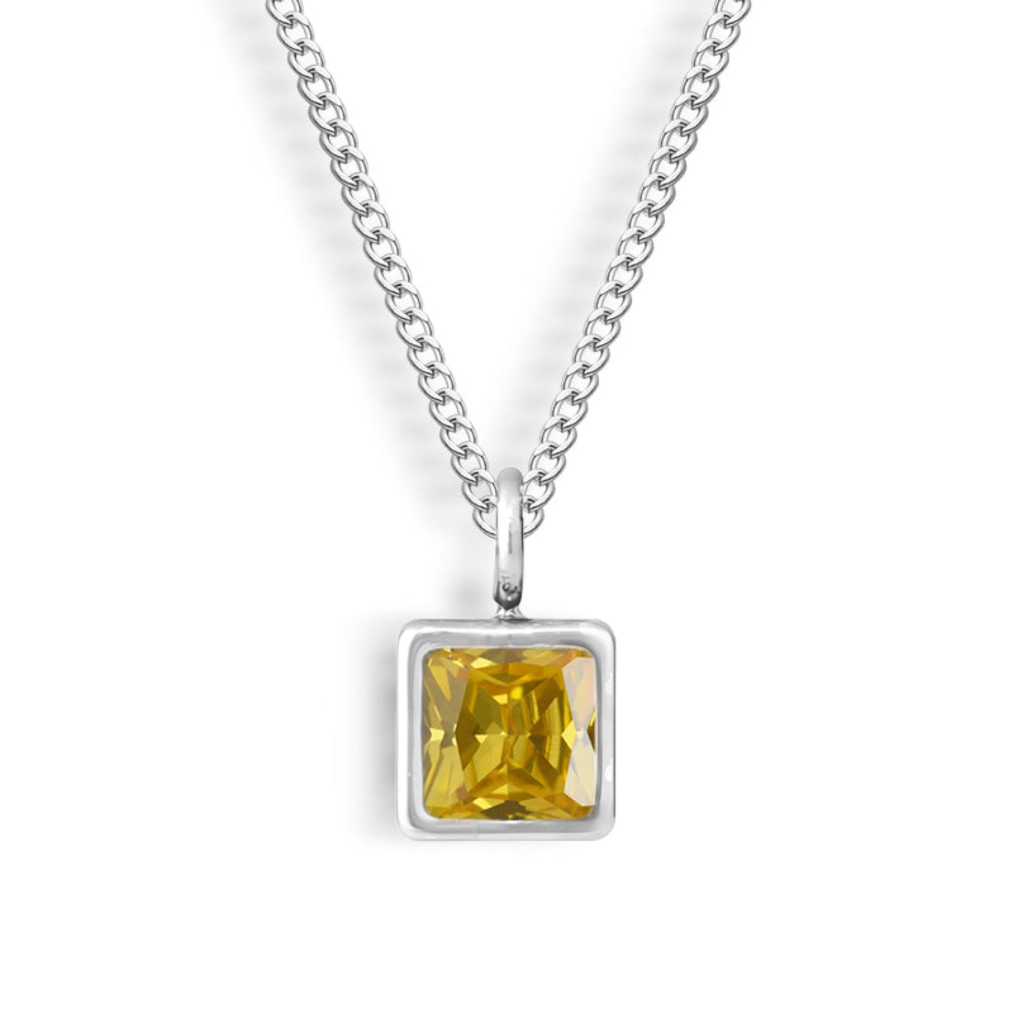 Square-Cut Stone Ring with Gold-Tone Band and Geometric Design