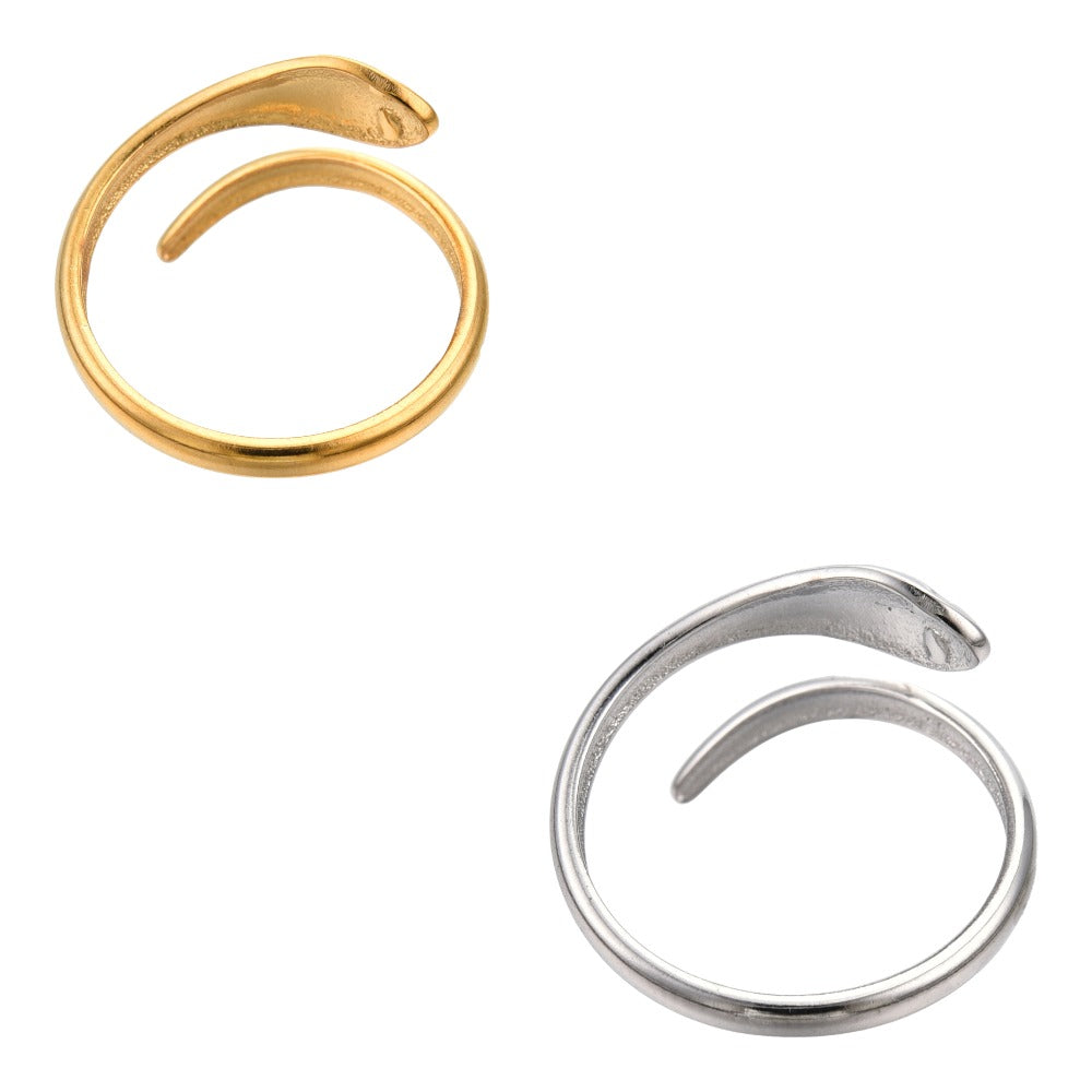 Gold and Silver Dainty Snake Wrap Ring backwards on an all white surface