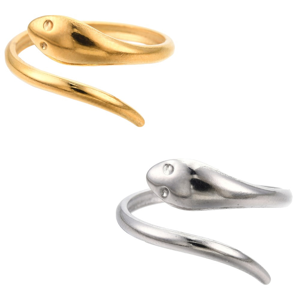Gold and Silver Dainty Snake Wrap Ring laying down on an all white surface