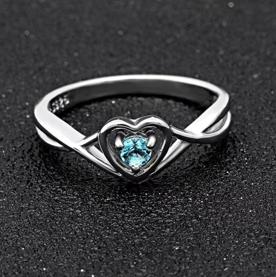 Heart-Shaped Cubic Zirconia Ring with Light Blue Stone and Three-Prong Setting