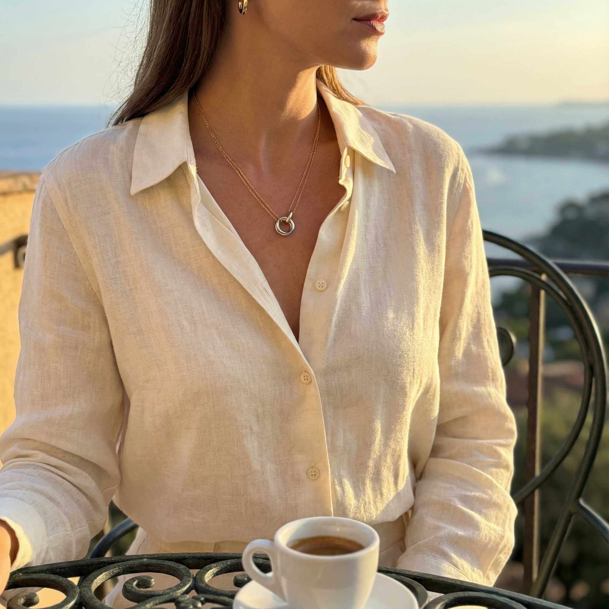The Unity Bond necklace by Brother & Sisters featured with warm gold bar and polished silver circle.