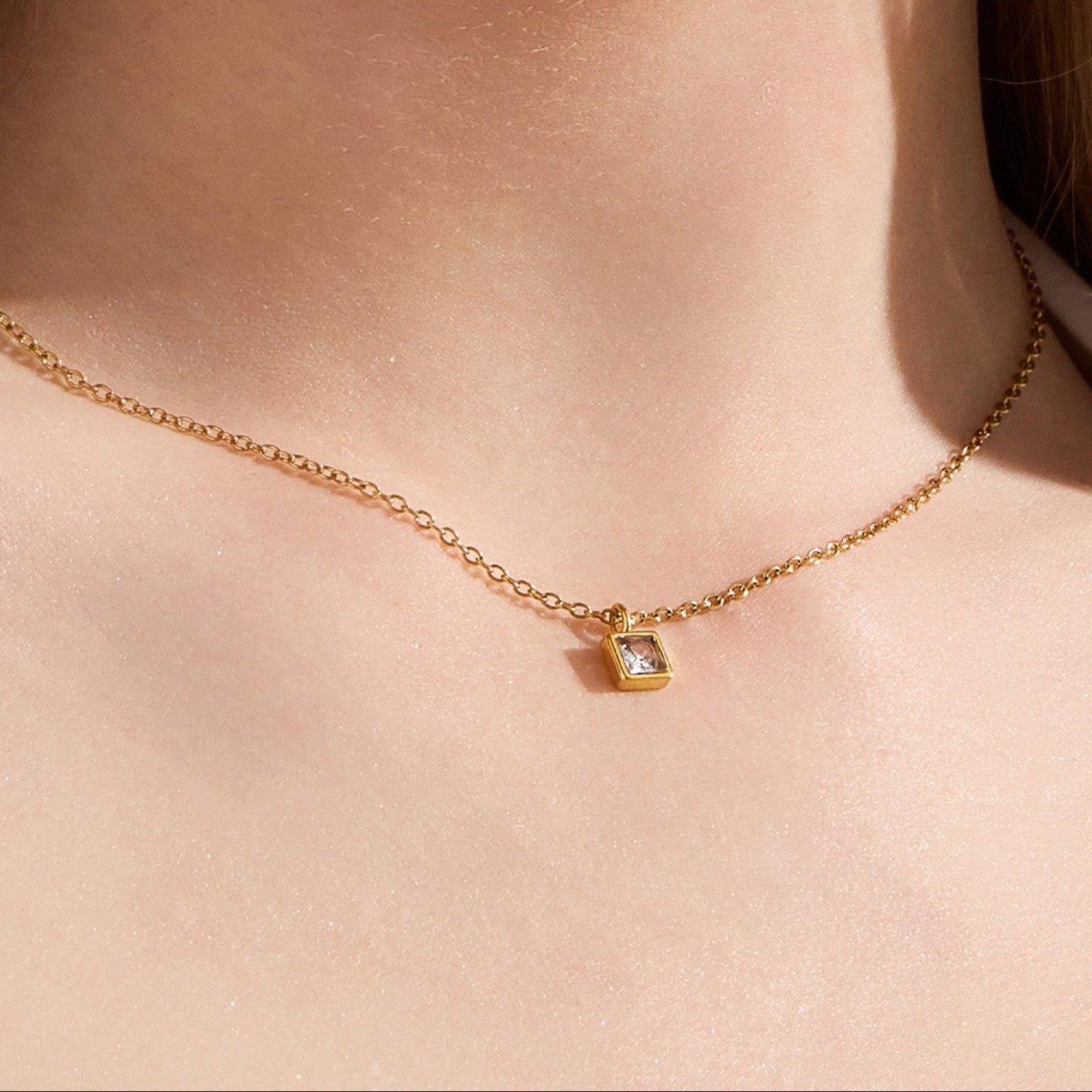 Square-Cut Stone Ring with Gold-Tone Band and Geometric Design
