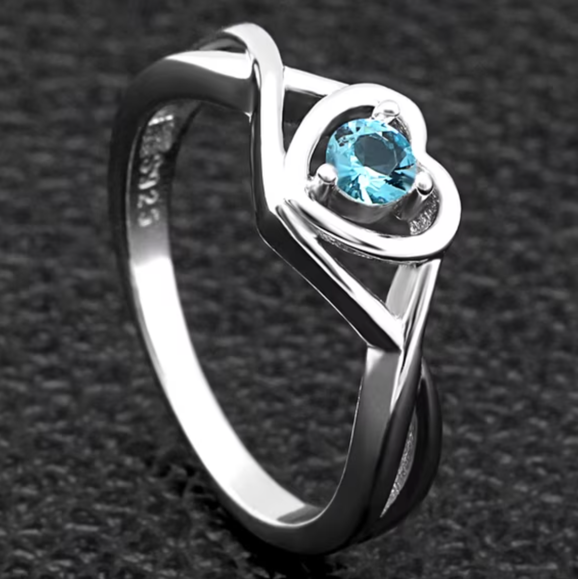 Heart-Shaped Cubic Zirconia Ring with Light Blue Stone and Three-Prong Setting