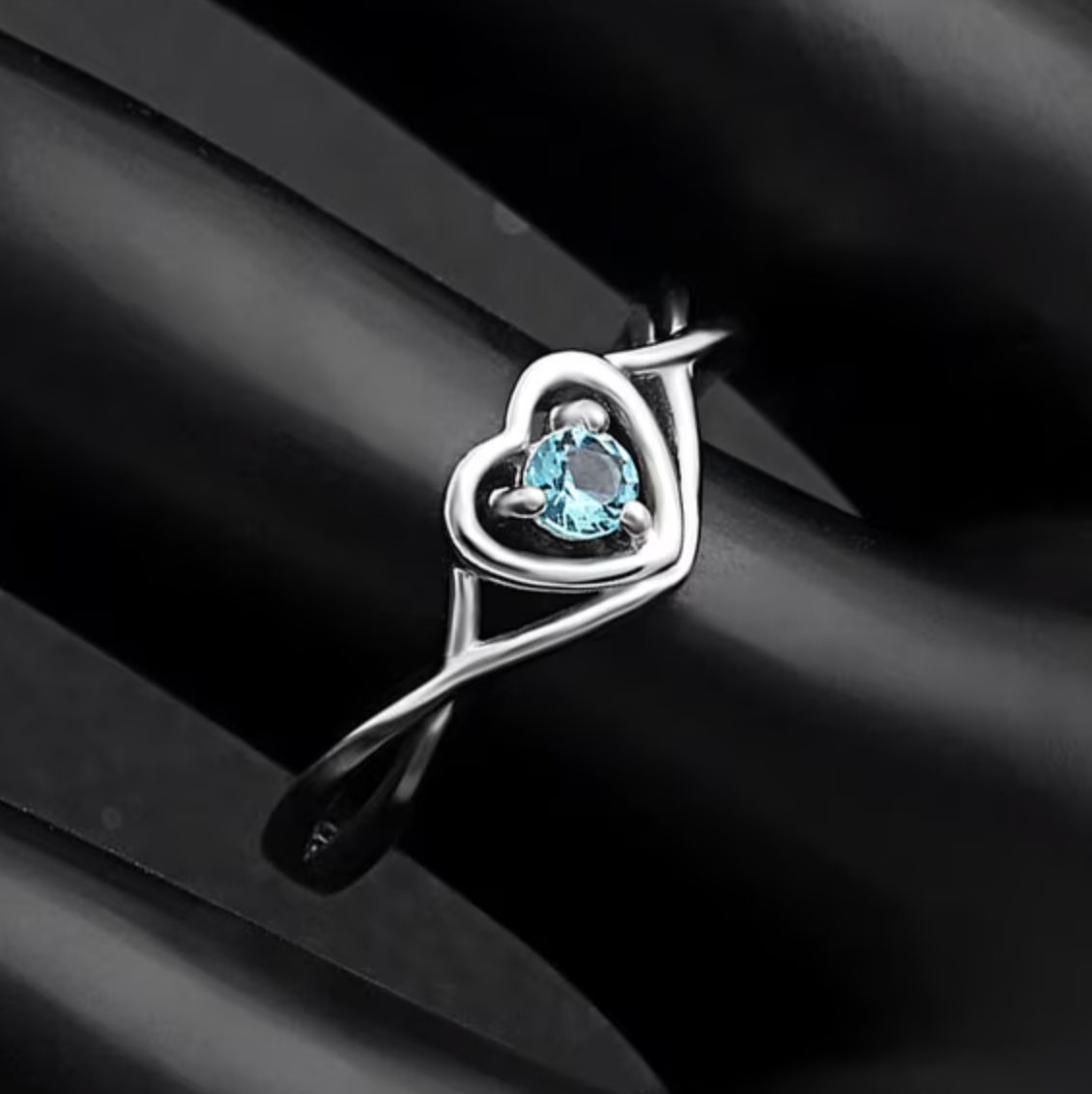 Heart-Shaped Cubic Zirconia Ring with Light Blue Stone and Three-Prong Setting
