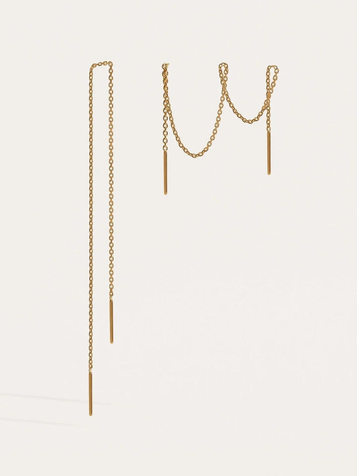 Pair of 24K gold plated ear thread earrings with fine chain and small bar ends, on a light background