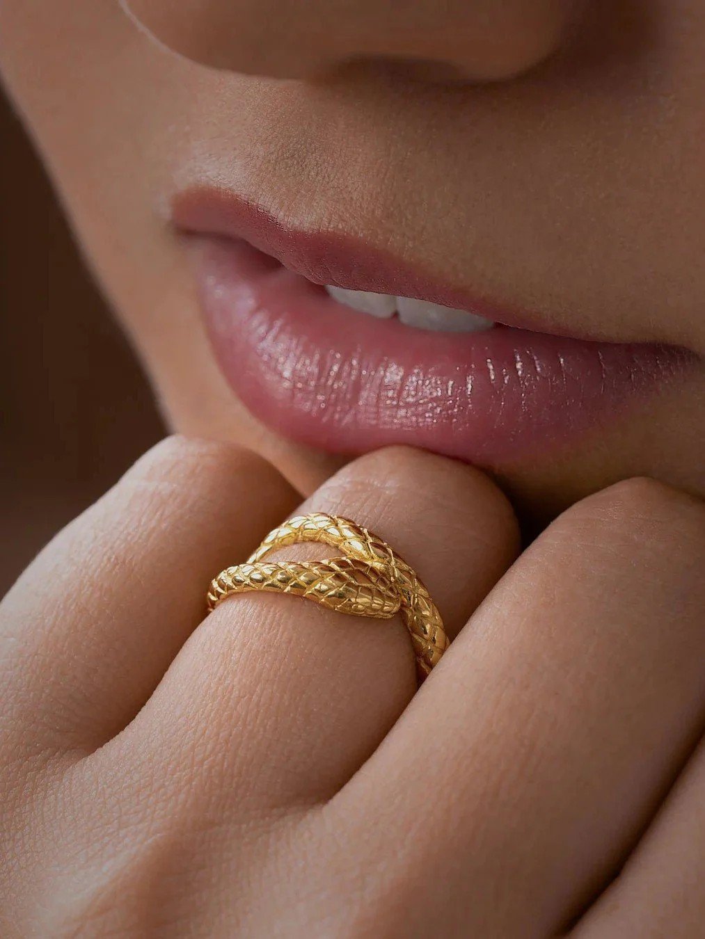 Sterling silver serpent ring with intricate details and an oxidized finish, inspired by quiet strength and timeless design.